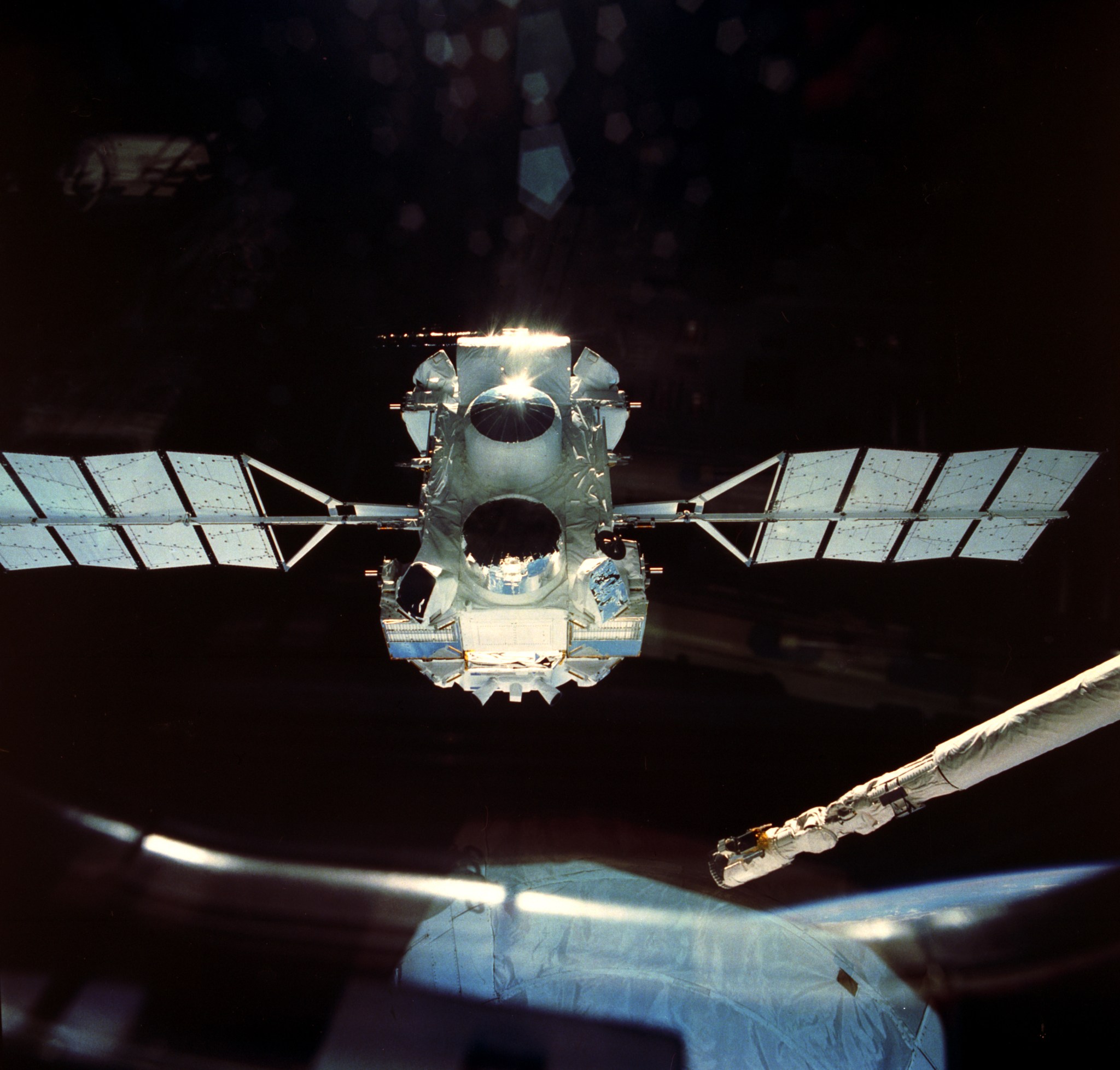Compton observatory drifting away from space shuttle following deployment in April 1991